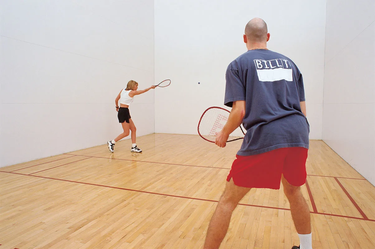 A racquetball game in progress at Springfield YMCA, highlighting the facility's sports amenities for adults.