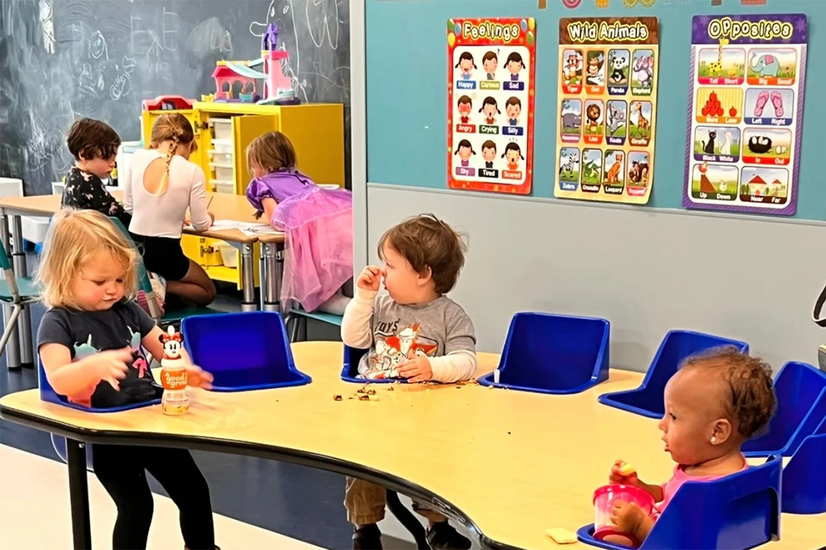 Children at Springfield YMCA’s childcare program participating in snack time, building friendships and social skills.