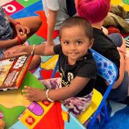 A group of children enjoying a storytime session at Springfield YMCA’s childcare center, promoting literacy and imagination.