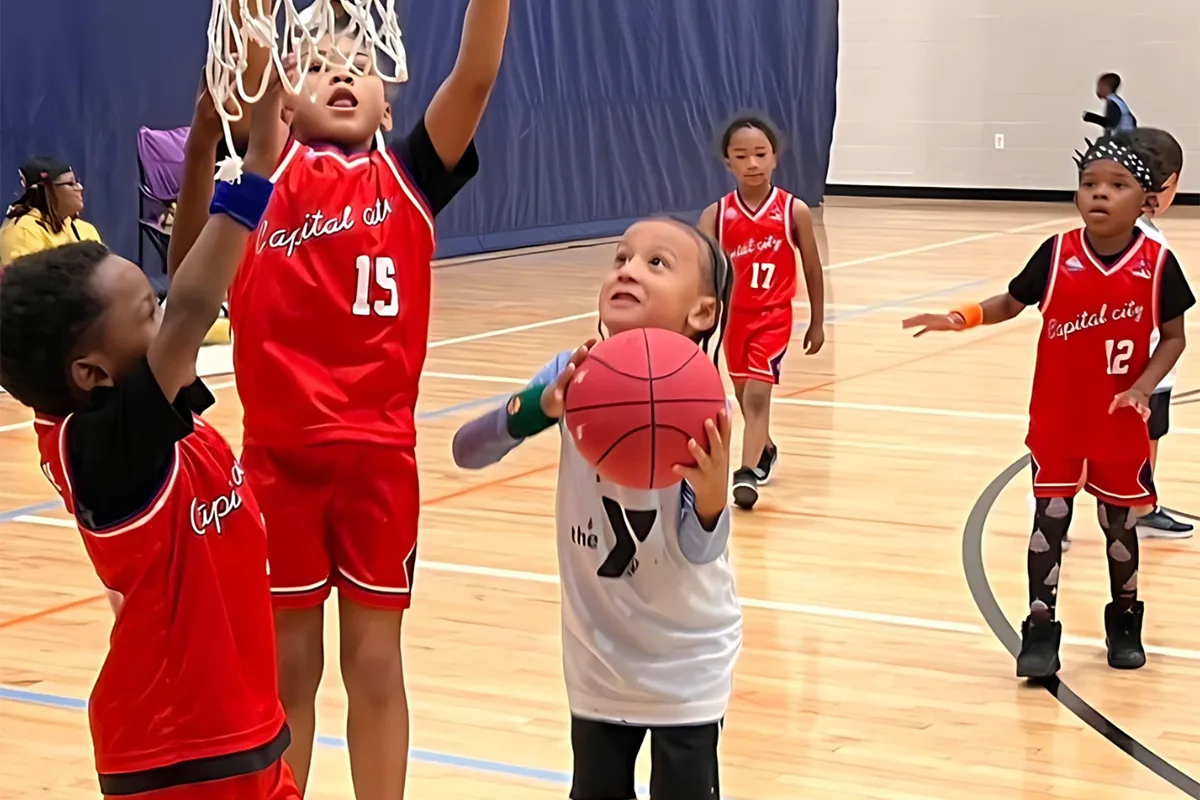 Young athletes playing basketball at Springfield YMCA, developing skills and teamwork in a supportive environment.