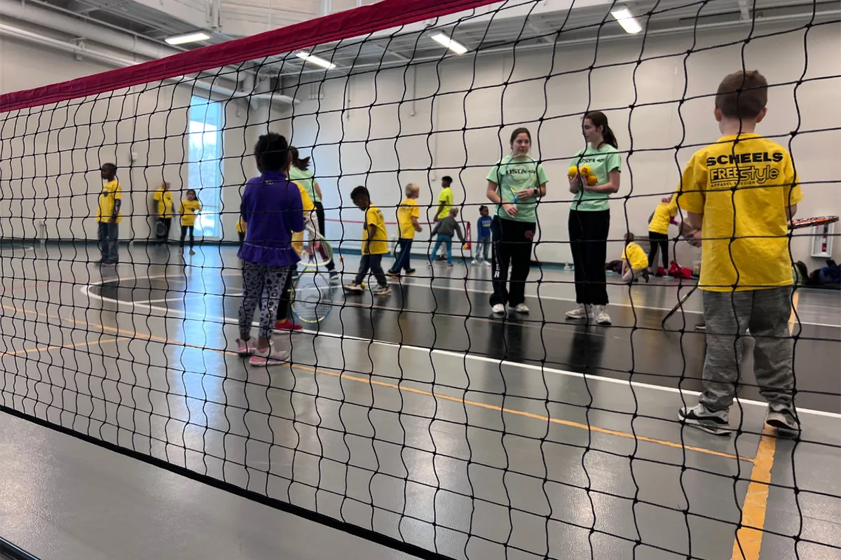 Children playing tennis at Springfield YMCA, developing hand-eye coordination and a love for the sport.