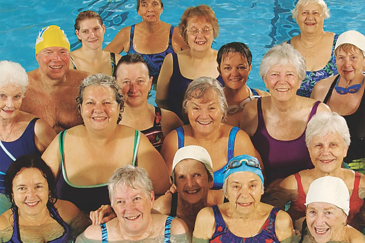 Adults participating in a water fitness class at Springfield YMCA, emphasizing aquatic exercise and health benefits.