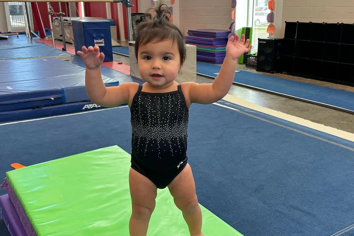 Young children practicing gymnastics in a Mini Bees class at Springfield YMCA, nurturing early physical development.