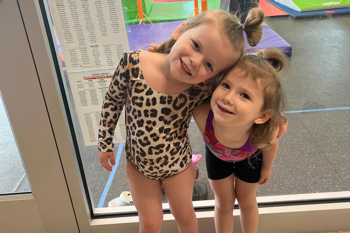 Toddlers learning basic gymnastics moves at Springfield YMCA, focusing on balance and coordination in a playful setting.