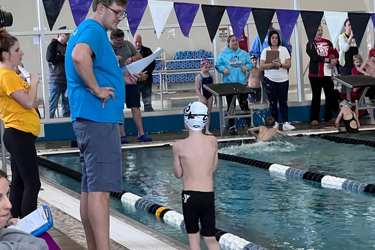 Junior swim team participants honing their skills in the pool at Springfield YMCA, building confidence and competitive spirit.